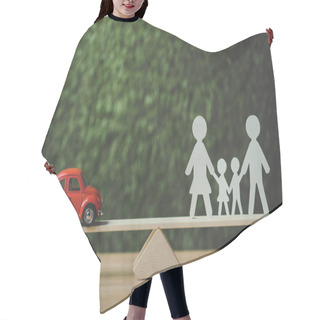 Personality  Red Miniature Car And Paper Cut Family Balancing On Swing On Green Background Hair Cutting Cape