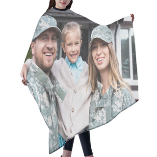 Personality  Happy Father And Mother In Military Uniforms Lifting Daughter And Looking At Camera On Blurred Background Hair Cutting Cape