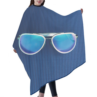 Personality  Stylish Sunglasses On Blue Background. Minimalism Fashion Hair Cutting Cape