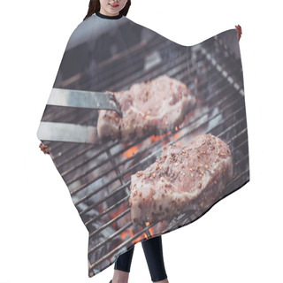 Personality  Selective Focus Of Juicy Raw Steaks Grilling On Barbecue Grid With Smoke And Tweezers Hair Cutting Cape