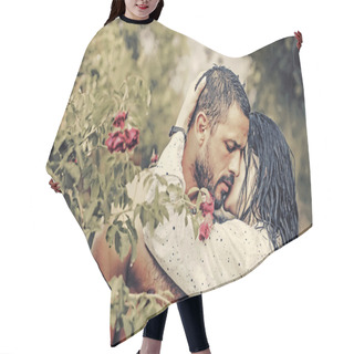 Personality  Love In The Garden. Passionate Couple In The Garden Hugging. Hair Cutting Cape