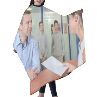 Personality  Lady Handing Form To Man At Reception Desk Hair Cutting Cape