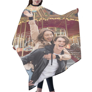 Personality  Excited Man In Black Jacket Piggybacking Happy Girlfriend In Amusement Park Hair Cutting Cape