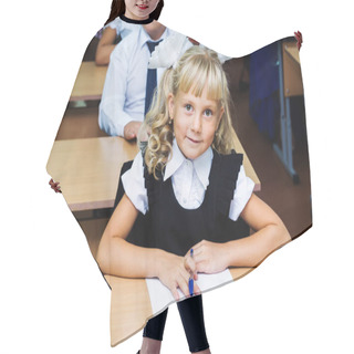 Personality  Girl First Grader Sitting At A Desk On The First Lesson On September 1 Hair Cutting Cape