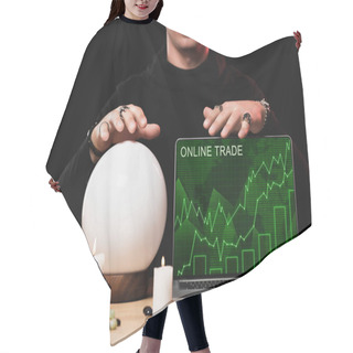 Personality  Cropped View Of Oracle Near Laptop With Online Trade Website On Screen Isolated On Black  Hair Cutting Cape