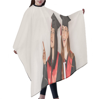 Personality  Pretty Student In Graduation Gown And Cap Pointing With Finger Near Cheerful Classmate, Senior 2021, Banner Hair Cutting Cape