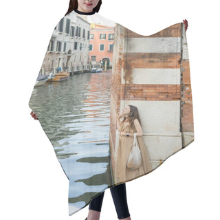 Personality  Side View Of Smiling Pregnant Woman With String Bag Standing Near Building And River In Venice  Hair Cutting Cape