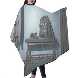 Personality  Military Backpack And Cap On Bench In Hallway At Home At Night  Hair Cutting Cape