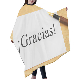 Personality  Spanish Thank You Message, A White Card On A Desk With A Pen With Text Gracias Hair Cutting Cape