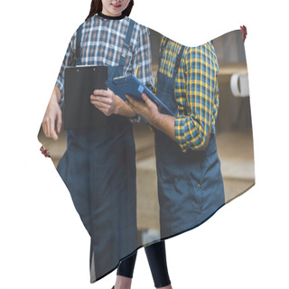 Personality  Cropped View Of Two Multicultural Warehouse Workers In Uniform Holding Clipboards Hair Cutting Cape