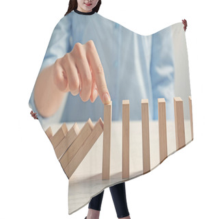 Personality  Businesswoman Hand Trying To Stop Toppling Dominoes On Table Hair Cutting Cape