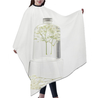 Personality  Organic Cosmetic Product In Transparent Bottle With Wildflowers On Stand Isolated On Grey Hair Cutting Cape