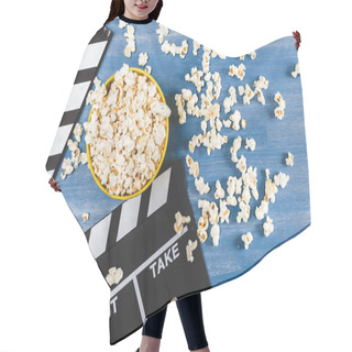 Personality  Elevated View Of Bucket Of Popcorn And Movie Clapper On Blue  Hair Cutting Cape