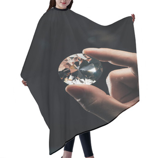 Personality  Cropped View Of Man Holding Big Clear Shiny Diamond On Black Background Hair Cutting Cape