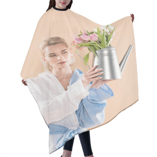 Personality  Attractive Girl Holding Watering Can With Flowers And Standing In Eco Clothing Isolated On Beige, Environmental Saving Concept  Hair Cutting Cape