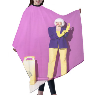 Personality  Girl In Wig Standing Near Wet Floor Sign And Putting On Rubber Gloves On Purple Background Hair Cutting Cape