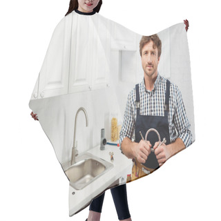 Personality  Handsome Plumber Holding Metal Pipe And Looking At Camera In Kitchen  Hair Cutting Cape
