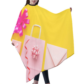 Personality  Top View Of Shopping Bag Near Gift Box And Envelope On Yellow Background  Hair Cutting Cape