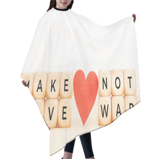 Personality  Make Love Not War Concept. Wooden Blocks With Text And Heart On Table. Copy Space Hair Cutting Cape