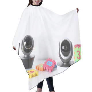Personality  Modern CCTV Security Cameras And Child Puzzle On Table Against White Background. Space For Text Hair Cutting Cape