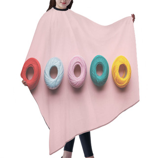 Personality  Top View Of Arranged Colorful Cotton Knitting Yarn Balls On Pink Hair Cutting Cape