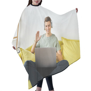 Personality  Cheerful Student With Headphones And Laptop In Yellow Couch Saying Hello To Online Meeting Hair Cutting Cape