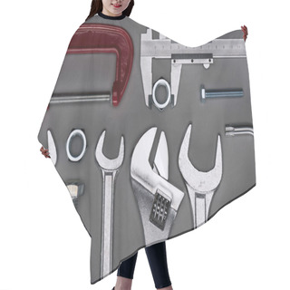 Personality  Top View Of Set Of  Various Work Tools On Grey Hair Cutting Cape