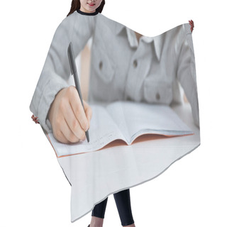 Personality  Cropped View Of Boy Writing On Notebook On Table  Hair Cutting Cape