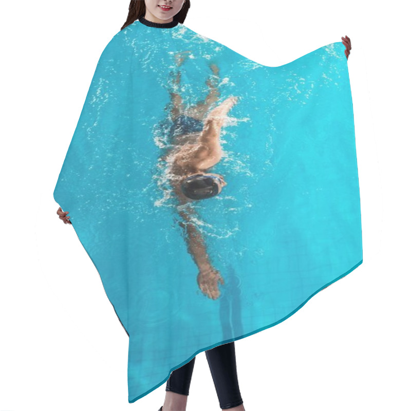Personality  professional swimmer in competition pool  hair cutting cape