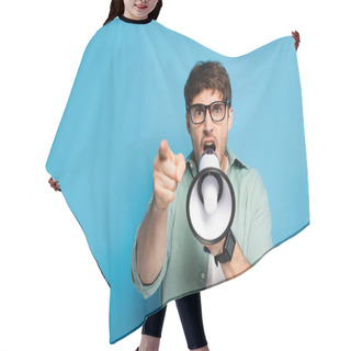 Personality  Aggressive Young Man Screaming In Megaphone And Pointing With Finger On Blue Hair Cutting Cape