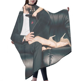 Personality  Cropped View Of Sexy Girl In Black Dress Holding Tie Of Bearded Man Sitting On Sofa  Hair Cutting Cape