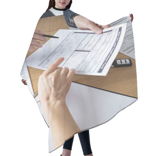 Personality  Cropped View Of Car Dealer Showing Car Loan Application Form To Woman In Office Hair Cutting Cape