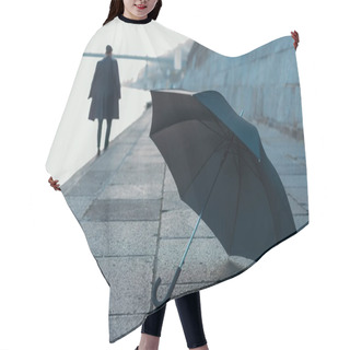 Personality  Umbrella Lying On River Shore While Man Walking Blurred On Background Hair Cutting Cape