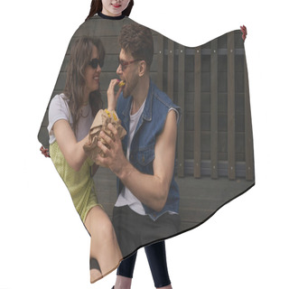 Personality  Positive Brunette Woman In Sunglasses And Sundress Feeding Boyfriend With Tasty Bun And Sitting Near Coffee To Go And Wooden House At Background, Serene Ambiance Concept, Tranquility Hair Cutting Cape