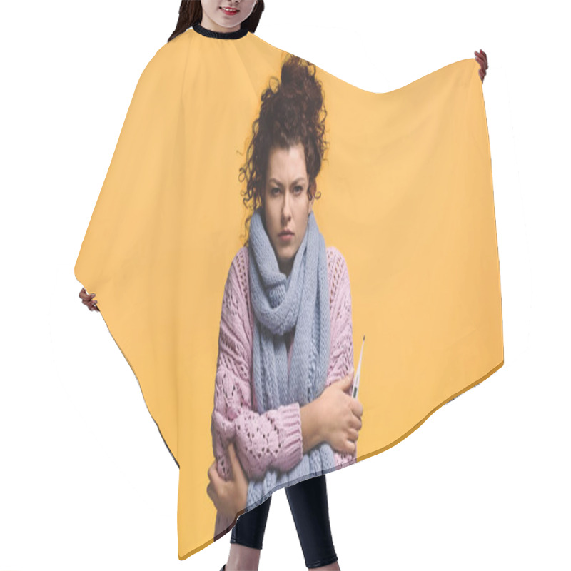 Personality  sick woman with fever holding thermometer isolated on orange hair cutting cape