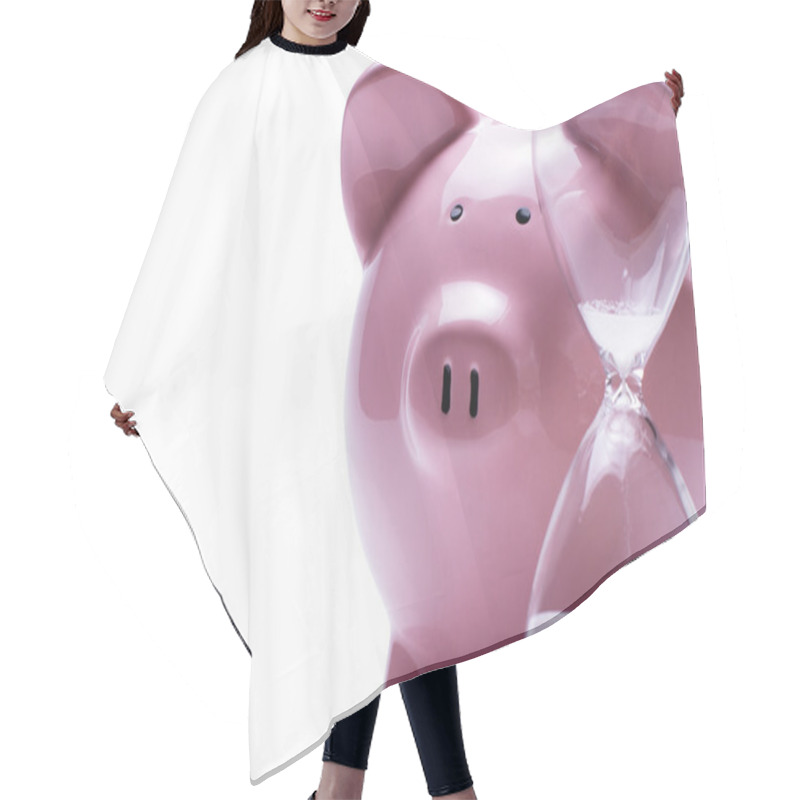 Personality  Egg Timer Next To A Piggy Bank, On White Hair Cutting Cape