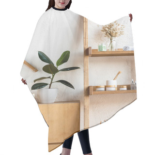 Personality  Wooden Rack With Blooming Catkins, Towel Rolls, Toothbrushes, Herbal Bags, Containers And Bottles Near Green Plants In Flowerpots  Hair Cutting Cape