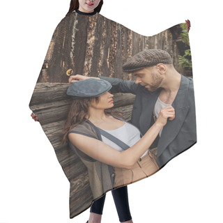 Personality  Fashionable And Passionate Woman In Suspenders And Newsboy Cap Touching Jacket Of Bearded Boyfriend While Standing Together Near Rustic House, Stylish Couple In Rural Setting Hair Cutting Cape