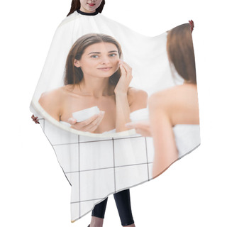 Personality  Pleased Woman Applying Face Cream Near Mirror In Bathroom, Blurred Foreground Hair Cutting Cape