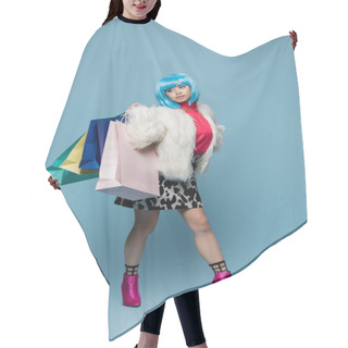Personality  Asian Pop Art Woman Holding Shopping Bags And Looking Away On Blue Background  Hair Cutting Cape