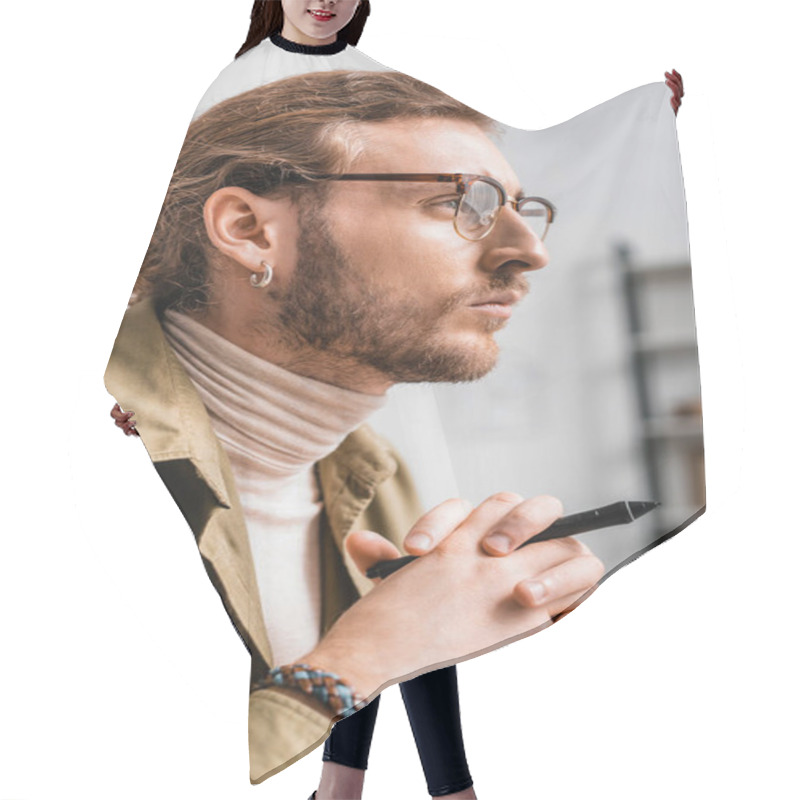 Personality  Side View Of Handsome 3d Artist Holding Stylus Of Graphics Tablet And Looking Away  Hair Cutting Cape