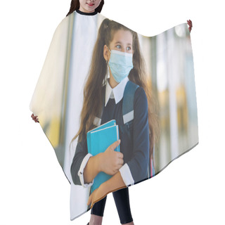 Personality  Schoolgirl In A Protective Mask With A Backpack And A Textbook In Her Hands. Security Concept, Virus Protection. Covid-2019. Hair Cutting Cape