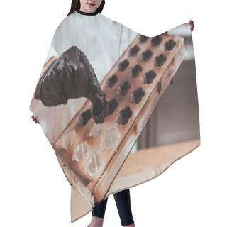 Personality  Cropped View Of Chocolatier Holding Chocolate Candy Near Ice Tray  Hair Cutting Cape