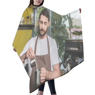 Personality  Focused Bearded Barista In Apron Holding Pitchers Near Coffee Machine In Coffee Shop Hair Cutting Cape