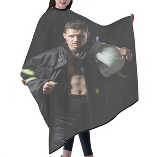 Personality  Fashionable Portrait Of A Young Man In Fire Equipment On A Black Studio Background. Fireman In A Dark Uniform Hair Cutting Cape