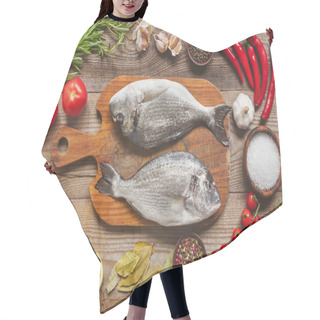 Personality  Food Composition With Raw Fish On Wooden Board Surrounded By Ingredients On Table Hair Cutting Cape