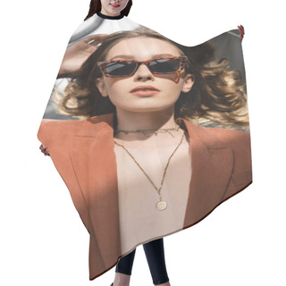 Personality  Top View Of Young Woman With Long Hair Wearing Terracotta And Trendy Suit With Blazer And Golden Necklace And Posing In Sunglasses On Grey Background, Beautiful Model, Sunlight  Hair Cutting Cape