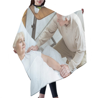 Personality  Overhead View Of Sick Senior Woman With Husband In Clinic Hair Cutting Cape