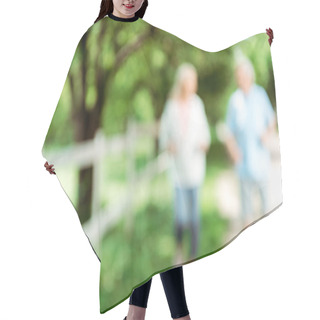 Personality  Blurred View Of Retired Woman Running Near Senior Man In Park  Hair Cutting Cape