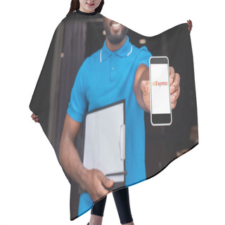 Personality  Cropped Image Of African American Delivery Man Showing Smartphone With Loaded Aliexpress Page Hair Cutting Cape